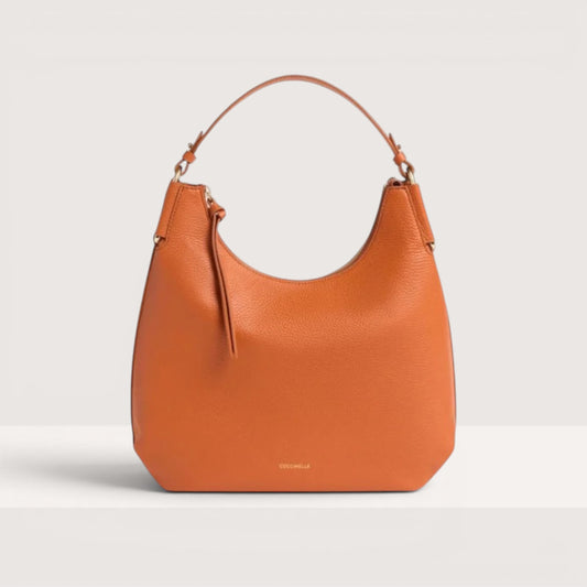 Руда італійська шкіряна жіноча сумка Coccinelle Rebekka Small E1 T95 13 02 01 R41