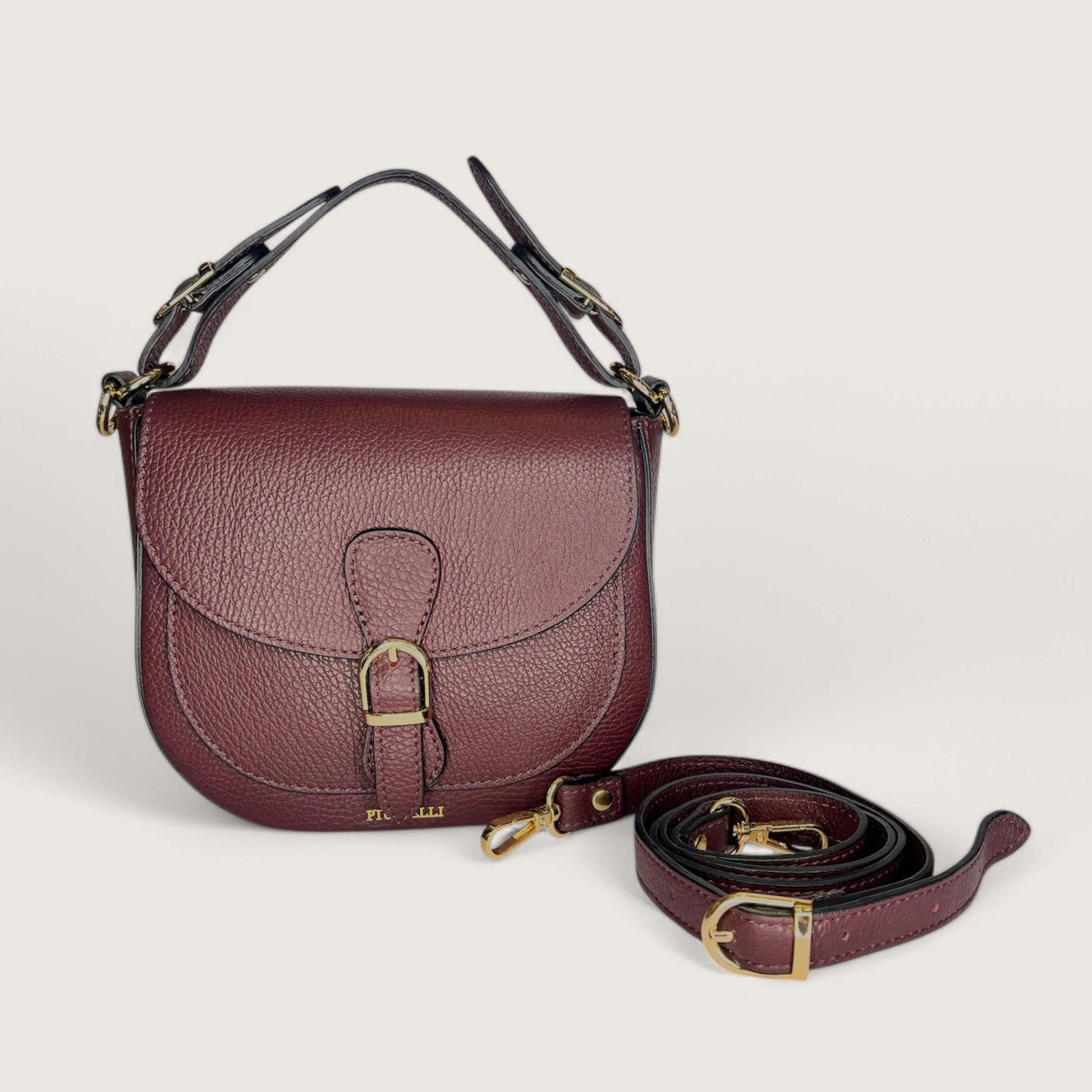 Італійська шкіряна жіноча сумка Piumelli Jole S D54 Burgundy кольору бургунді